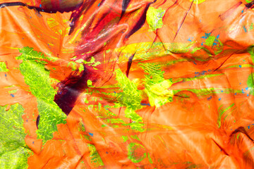 Thick abstract paint surface with heavy texture looking a bit like graffiti hand drawn real orange background