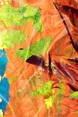 Thick abstract paint surface with heavy texture looking a bit like graffiti hand drawn real orange...