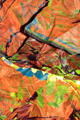 Thick abstract paint surface with heavy texture looking a bit like graffiti hand drawn real orange...