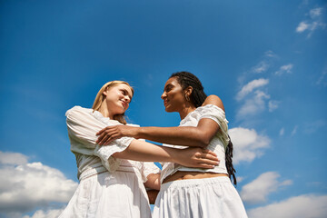 Beautiful young couple enjoying a sunny day in a grassy field under a blue sky