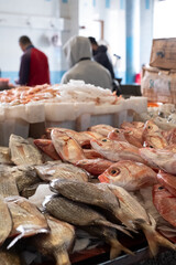 Fresh catch on display on the counter at the fish souk market in the old town medina in Tangiers Tangier Morocco.
