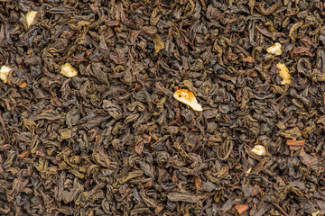 Black tea with bergamot macro photo as background. Drink, loose leaf tea.