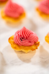 Lemon Spritz Cookie Sandwich with Cranberry Buttercream
