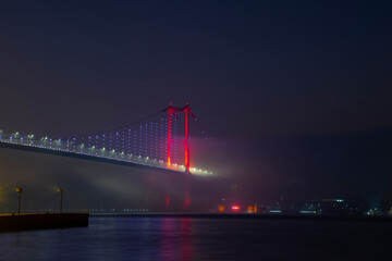 Magnificent foggy night view from the July 15 Martyrs Bridge (Bosphorus Bridge). A wonderful foggy night view of Ortakoy.