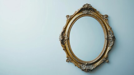 Antique gold-framed oval mirror on a light blue wall