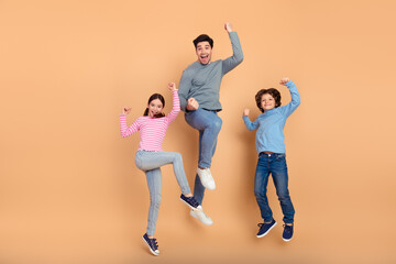 Cheerful family bonding together in a cheerful moment of joy and fun captured with expressions of love and companionship