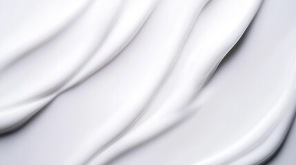 Obraz premium close up of white cosmetic cream creating abstract pattern with smooth, flowing lines. texture appears soft and luxurious, evoking sense of purity and elegance