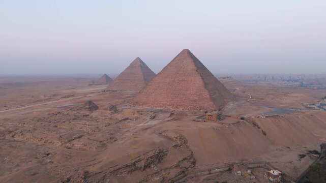 Giza Necropolis Pyramids And Eastern Cemetery In Cairo, Egypt. - aerial shot