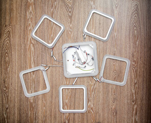 Modern geometric led chandelier on wooden background, close-up