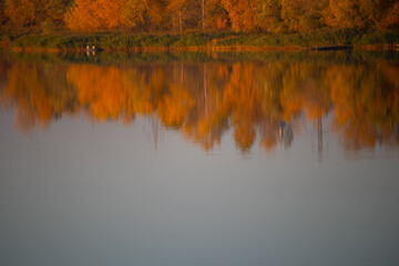 glare and reflections on the water. the sky is reflected in the water. Background of waves,...