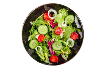 Vegetable salad tomato, cucumber, lettuce, green leaf lettuce, onion appetizer vegetable dish fresh gourmet food background rustic food top view copy space keto and paleo diet vegetarian vegan food