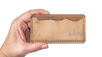 Hand Holding Leather Card Holder: An aged, well-loved, and weathered leather card holder rests delicately in a person's hand. Every crease and mark tells a story of durability and timelessness.