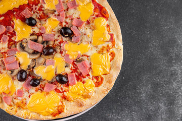 Pizza ham, mushrooms, olives, cheese appetizer vegetable dish fresh delicious gourmet food background on the table rustic food top view copy space