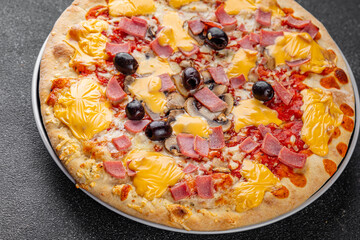 Pizza ham, mushrooms, olives, cheese appetizer vegetable dish fresh delicious gourmet food background on the table rustic food top view copy space