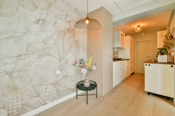 A chic kitchen featuring a unique wall design, modern appliances, and stylish decor, creating an inviting space for cooking and gathering.