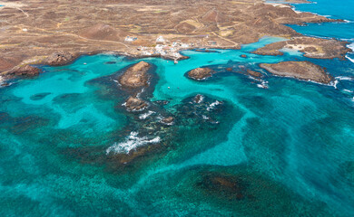 Aerial view of Puertito village and the beautiful natural pools  lagoons of the island of Lobos near Corralejo in Fuerteventura Spain