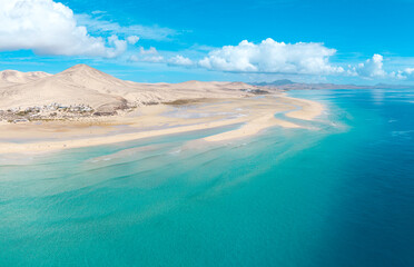 Stunning high aspect aerial panoramic view of the beautiful tropical looking beach, lagoon and sand dunes at Sotavento Risco del Paso beach near Costa Calma on Fuerteventura Canary Islands Spain