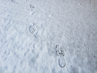 Tire tread prints on the ground. tire tracks. Tire tracks on a sandy road. Car tread prints on the sand. Footprint and traces of an off-road car tires in the mud. tire prints in the snow.