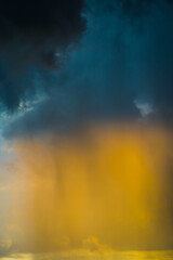 Yellow light in dark thunder sky