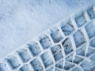 Tire tread prints on the ground. tire tracks. Tire tracks on a sandy road. Car tread prints on the...