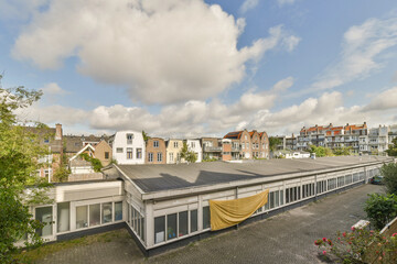 A scenic rooftop view showcasing modern and historic buildings under a partly cloudy sky,...