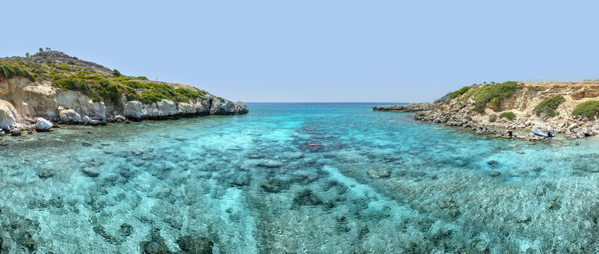 Crystal clear turquoise water in a Fokia closed bay. One of the famous places for great snorkeling. Vacation concept on Greece islands in Aegean and Mediterranean sea. Pefki. East Rhodes. Greece