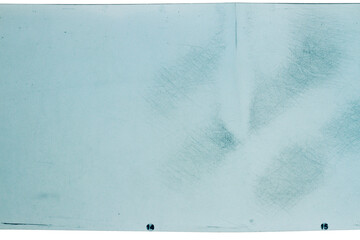 Grungy color 120mm negative film isolated on white background. Medium format film material on white...