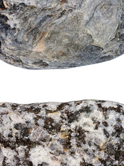 Edges of two pebbles isolated on white background with a space for text