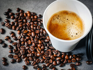 Coffee crema espresso in paper Coffee cup and bean on gray background, Top view of Espresso in  Takeaway paper coffee cup.