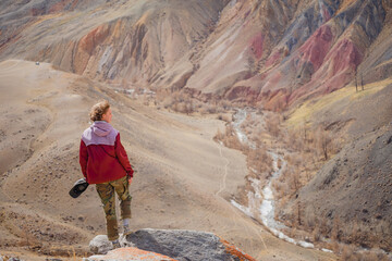 girl in a bright windbreaker enjoys the picturesque views