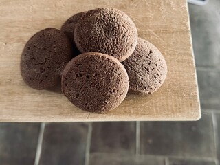 Homemade healthy carob cookies on rustic background, sugar-free vegan snack.