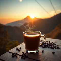Full outdoor shot of a cup of coffee with smoke and coffee seeds on a wooden table, while the sun rises over a mountain range in the background