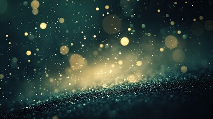 Obraz premium A dark teal background with glittering golden lights and bokeh.