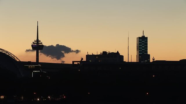 Silhouette of Cologne's Colonius Tower and MediaPark at Dusk
