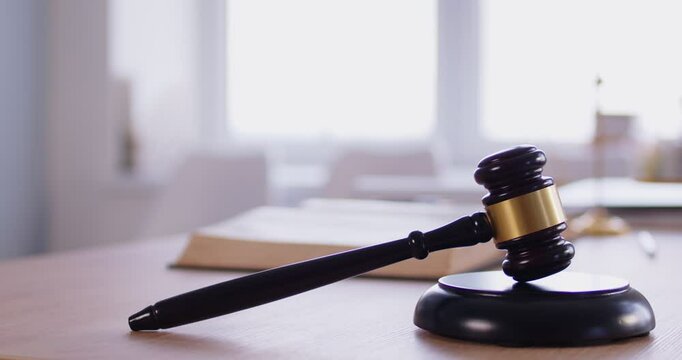 Gavel wooden hammer symbol of law, authority for court and auction on desk to bang, judge sentences, accuse guilty, proclamation, pass judgment, hitting on table to get attention, punctuate rulings