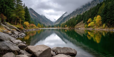 Serene mountain lake reflects trees and sky in autumn, nature background use