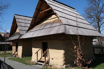 Hiscoric buildings named sypaniec in Kacwin, Poland. These are original Spis granaries - wooden grain warehouses, stone foundation covered with clay with movable sloping roof.