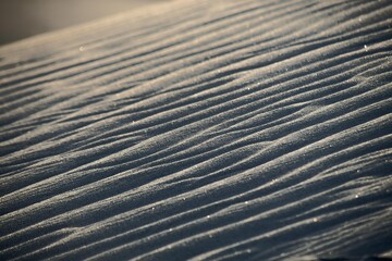 Contrast of the sun on the sand and dunes of the desert
