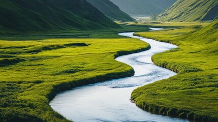 Serpentine river flowing through lush green valley on a bright sunny day