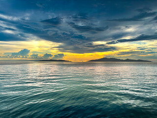 sunset view at dusk between Maniang Island and Padamarang Island