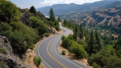 Fototapeta premium Road trip car driving winding mountain road for tourism & scenic background