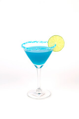 Blue martini cocktail with lime and lemon served in a glass with ice for a party celebration