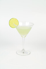 Iced alcoholic beverages include a martini with lemon and a cocktail with lime in a glass