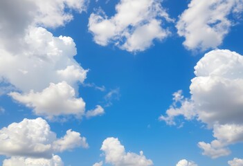 Fototapeta premium Fluffy white cumulus clouds dominate a vibrant blue sky, ideal for serene backgrounds, texture, view