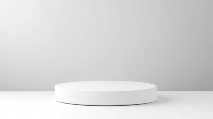 Minimalist white cylindrical podium on white background.