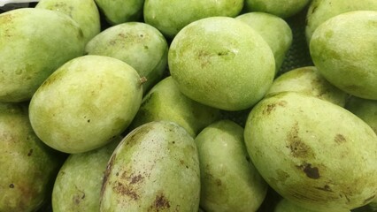A Close Up View of Fresh Green Mangoes Ready for Sale at Market