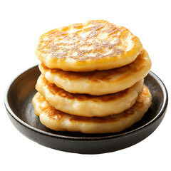 Golden Brown Pancakes Stacked on a Dark Dish