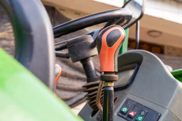 The steering wheel and gear lever of modern plowshares