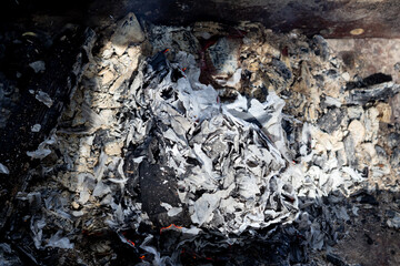 Remains of a fire with grey ash and burned-out wood, telling a quiet story of something that has already passed.