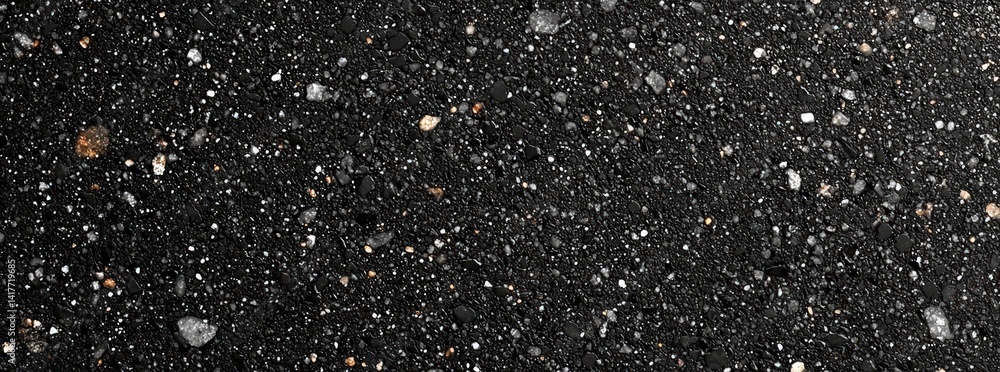 Poster a textured surface featuring a dark background with various small stones and granules embedded throu